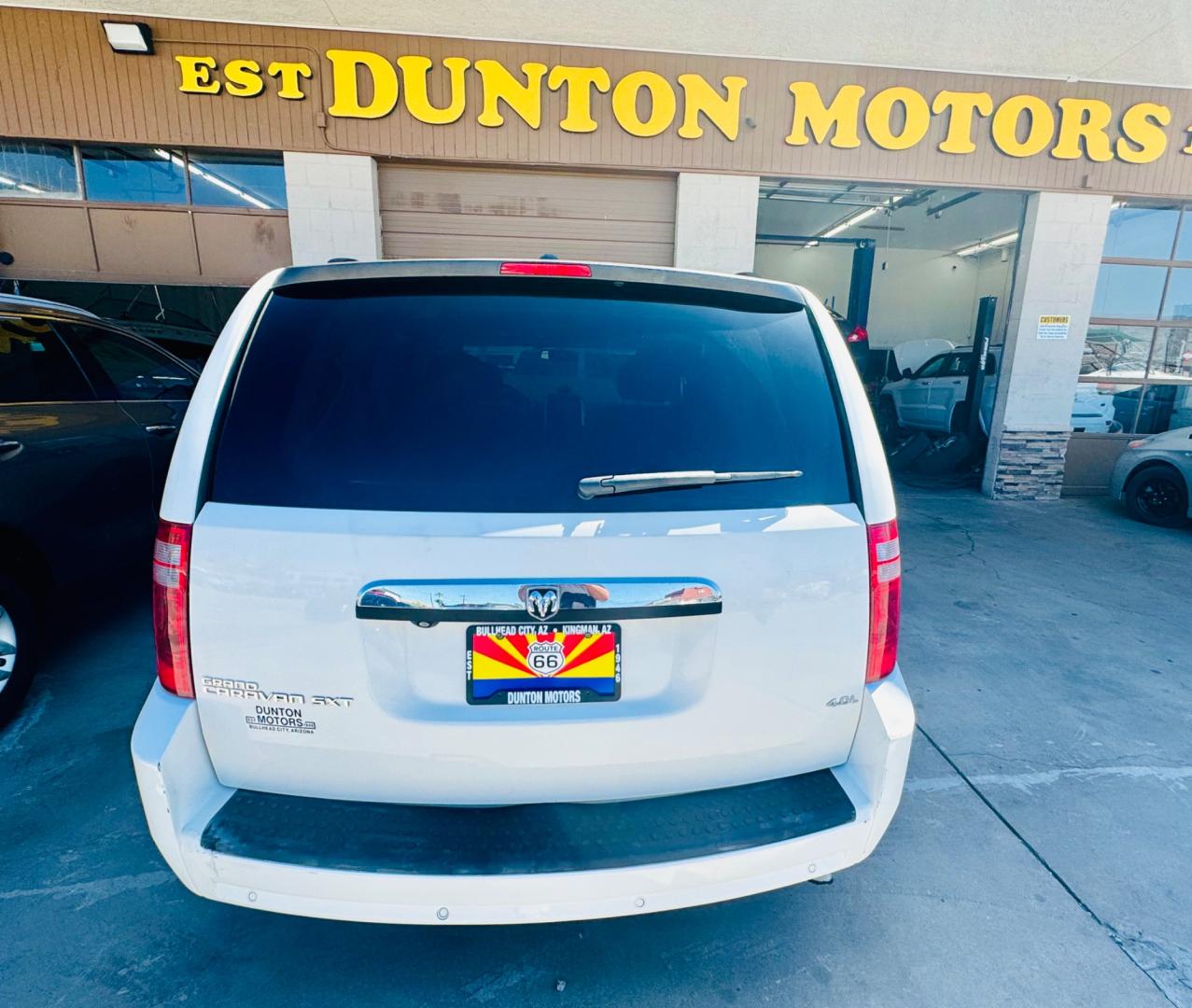 2008 White /black Dodge Caravan (2D8HN54XX8R) , located at 2190 Hwy 95, Bullhead City, AZ, 86442, (928) 704-0060, 0.000000, 0.000000 - 2008 Dodge caravan SXt. leather loaded, backup camera, bluetooth, satellite radio, rear tv,dvd player. moonroof. stow and go seating. seating for 7. free carfax, free warranty. - Photo#1